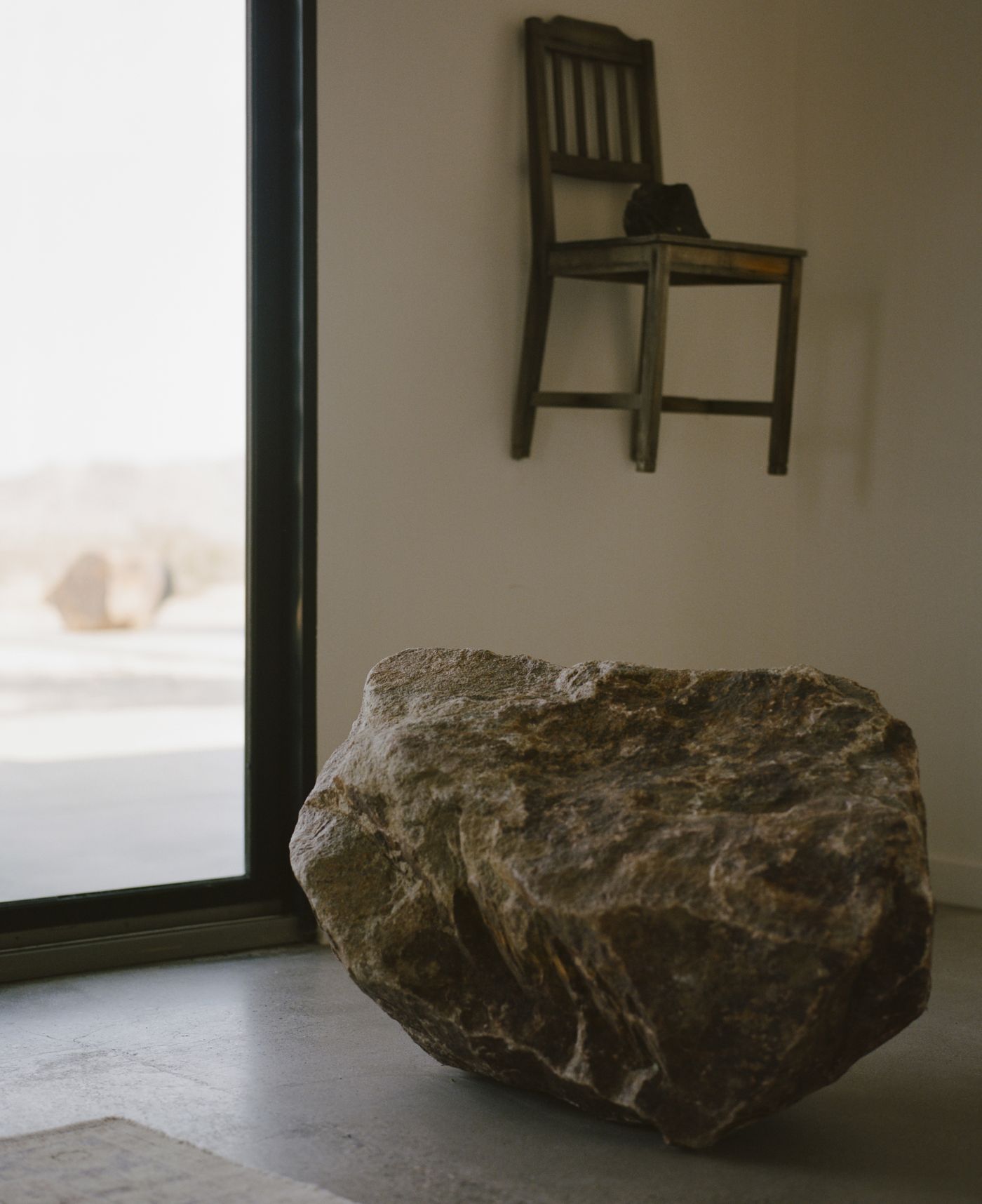 A found boulder placed inside the main room