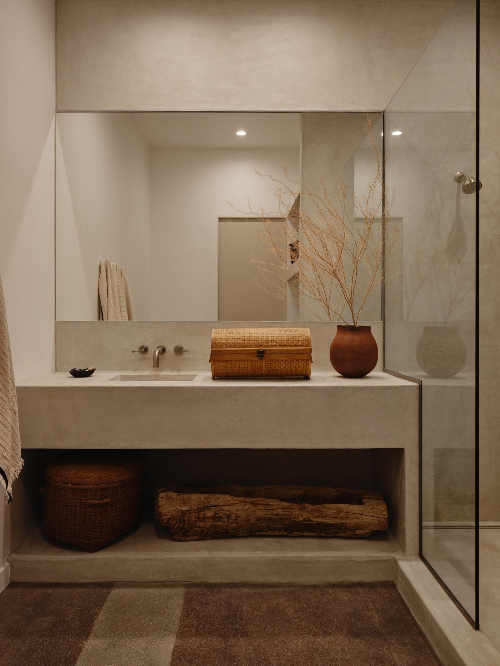 Concrete spa bath with walk-in shower