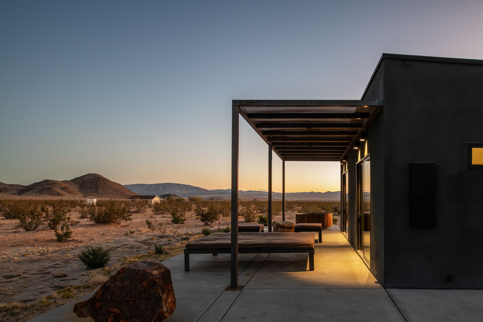 Steel pergola and bench at sunset